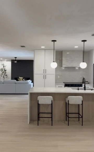 Completed open kitchen and living space with fluted island